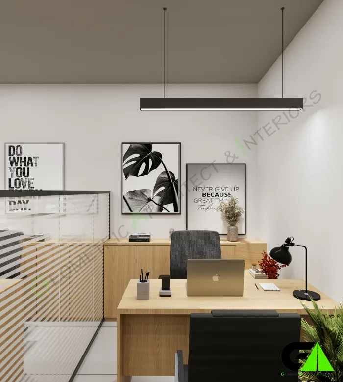 Modern workstation in small office interior design in Mirpur with wood desk, black chair and laptop